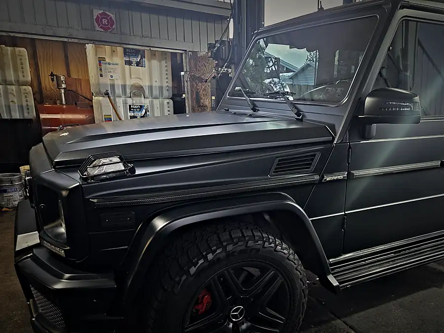 Matte black Mercedes-AMG G63 in the service bay